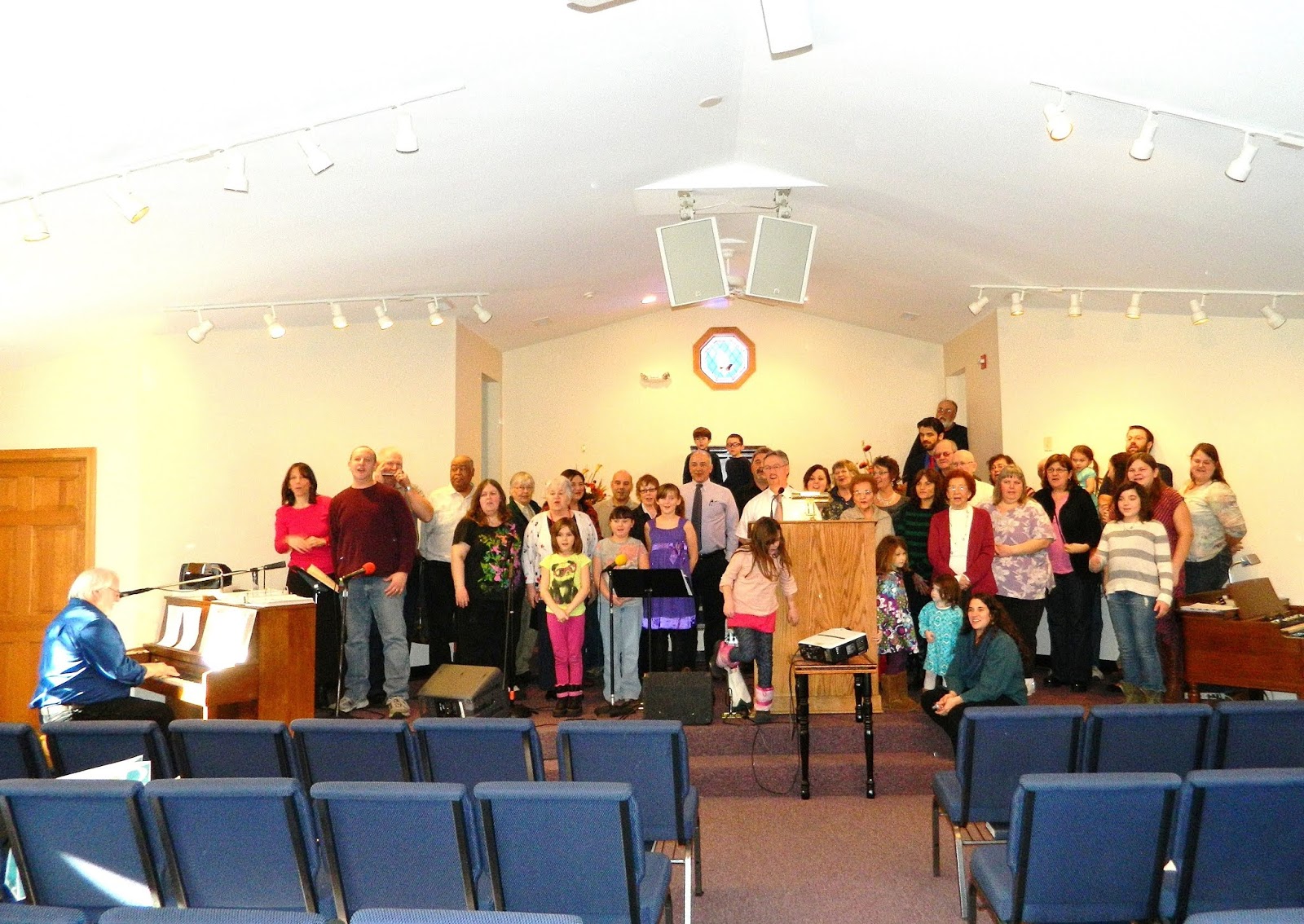 The ecclesia singing happy birthday to Mary